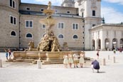 Residenzbrunnen On Residenzplatz With Tourists Posing In Sound Of Music Costumes, Salzburg, Austria