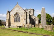The Rudston Parish Church Of All Saints With The Monolith, Yorkshire, England