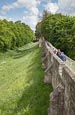 People Walking Around The Historic City Walls At York, Yorkshire, England