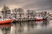 Thumbnail image of Old buildings and boats on the Alter Strom, Warnemuende, Mecklenburg Vorpommern, Germany