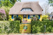 Typical Thatched Cottage And Garden At Born Auf Dem Darss, Mecklenburg-Vorpommern, Germany