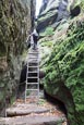 Thumbnail image of Walker climbing the path to the Schrammstein view, Sachsische Schweiz, Saxony, Germany