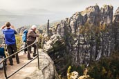 Thumbnail image of walkers looking at the view of the Schrammstein rocks in the Elbe Sandstone mountains, Sachsische Sc