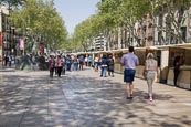 People Walking On La Rambla With Art And Souvenir Stalls, Barcelona, Catalonia, Spain