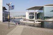 Tourist Boat At The Government District And River Spree With Tourism Signpost, Berlin, Germany