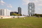 People In The Former Death Strip At The East Side Gallery With A New Luxury Apartment Block Behind, 